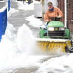 sweeping snow by Morgantown High School